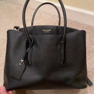 Black, pebbled grain, Kate Spade bag. Very good used condition.